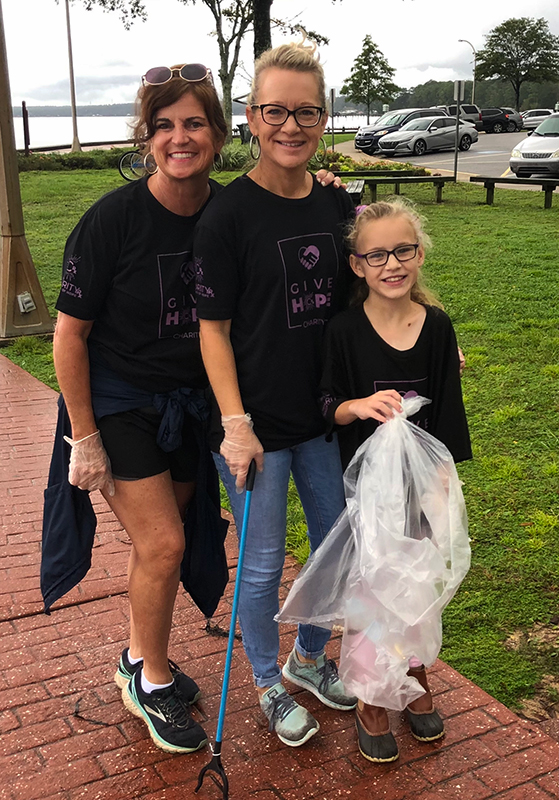 Debbie Morgan, Tonya Saucer, and Holin Saucer at the beach for cleanup day.