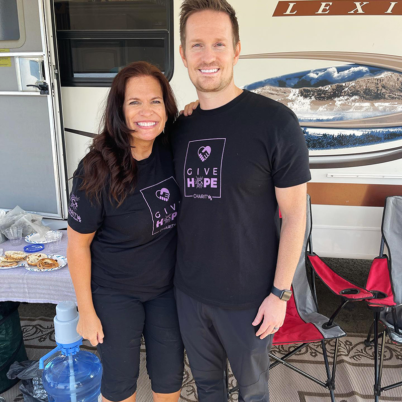 Mary Tockstein and CharityRx CEO, Eric Beaumont stand together outside an RV