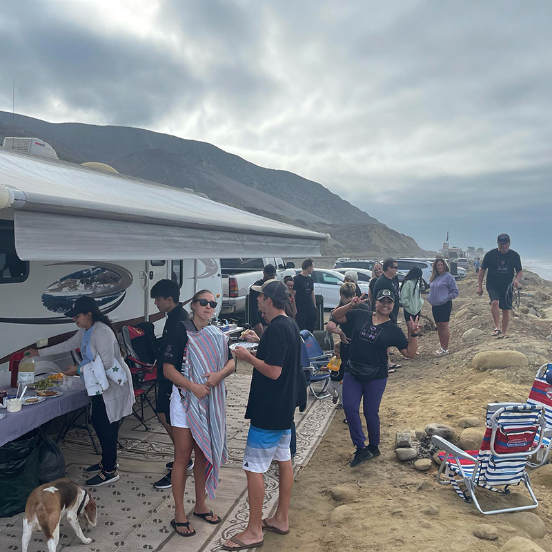 Volunteers enjoying a barbecue lunch on the beach