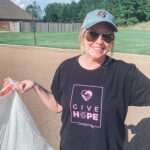 Jodi Hinds shows the trash she picked up around her community.