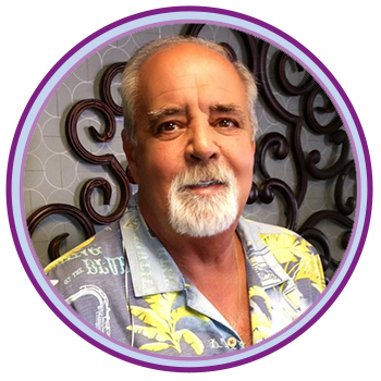 headshot of Paul Mancuso wearing a Hawaiian-style shirt