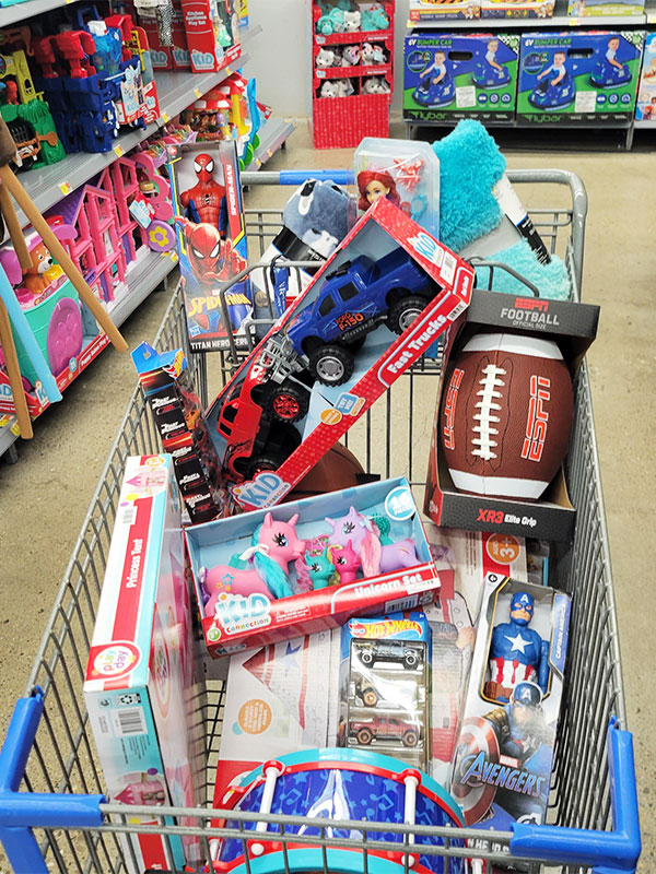 Image of a shopping cart full of toys.