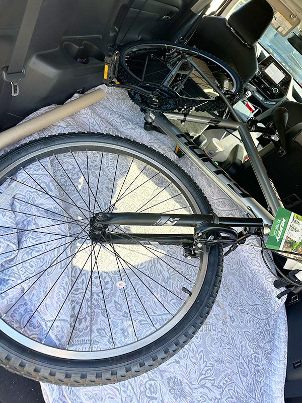 Image of a kid's bike in the back of a car