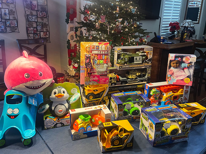Image of a stack of toys and games to be donated.