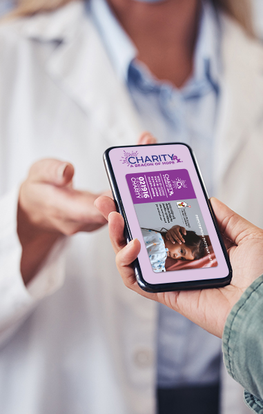 Image of a person handing their smart phone to a pharmacist. The image on the phone is the CharityRx Prescription Discount Card.